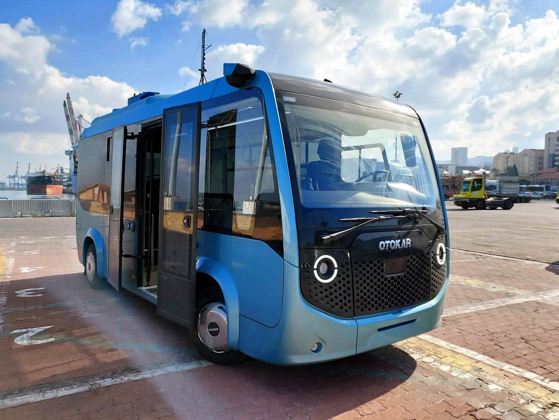 Blue autonomous bus at dock