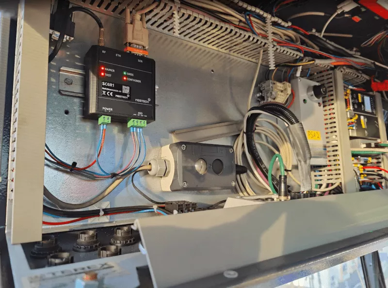 Boxed GNSS receiver installed in a machine control cabinet