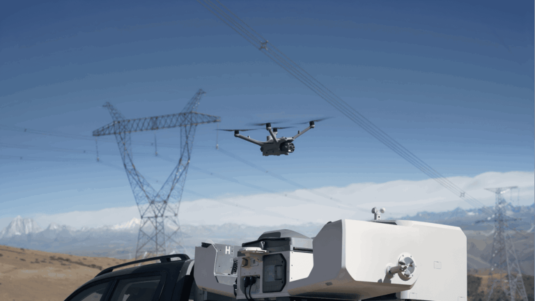Drone inspecting power lines outdoors